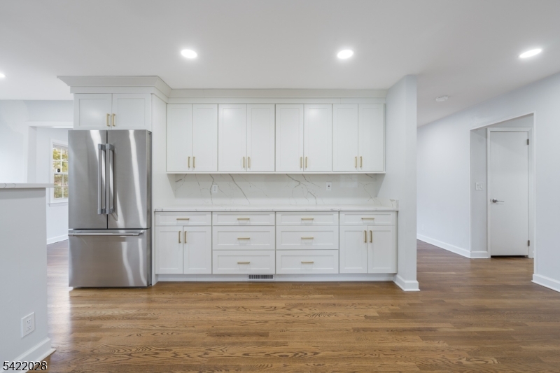 6 Windsor Way Berkeley Heights, NJ 07922 - Photo 13 of 36 a kitchen with granite countertop a refrigerator and a stove top oven