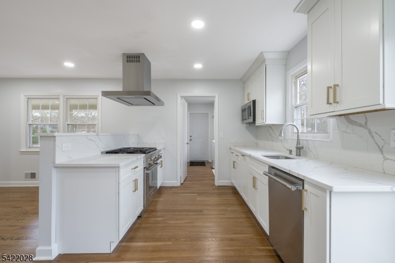 6 Windsor Way Berkeley Heights, NJ 07922 - Photo 14 of 36 a kitchen with stainless steel appliances granite countertop a sink and a stove