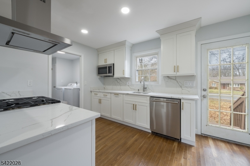6 Windsor Way Berkeley Heights, NJ 07922 - Photo 15 of 36 a kitchen with a sink stove and cabinets
