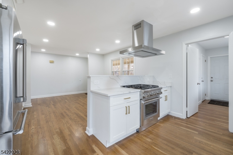 6 Windsor Way Berkeley Heights, NJ 07922 - Photo 17 of 36 a kitchen with stainless steel appliances a stove and a wooden floors