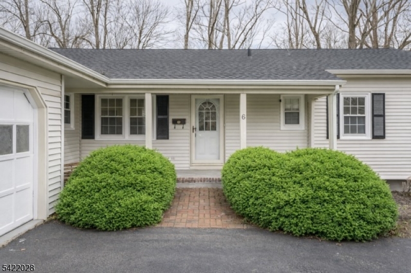 6 Windsor Way Berkeley Heights, NJ 07922 - Photo 2 of 36 front view of a house with a garden