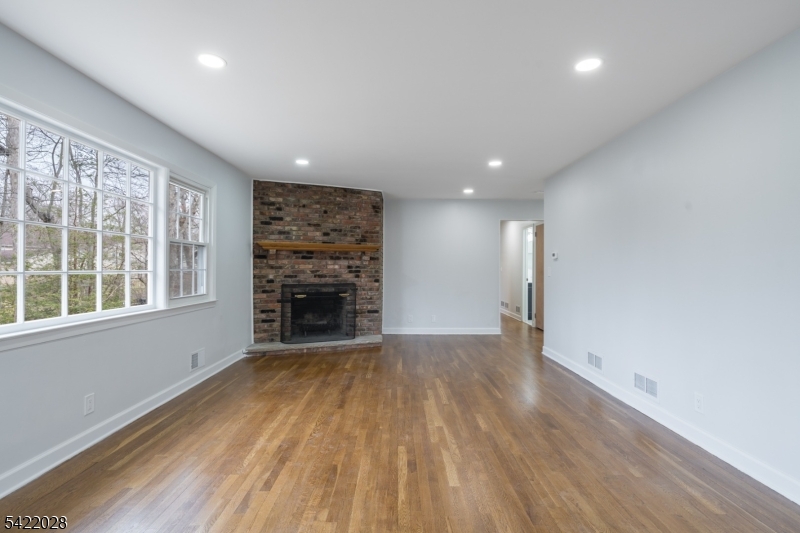 6 Windsor Way Berkeley Heights, NJ 07922 - Photo 21 of 36 wooden floor in an empty room with a window