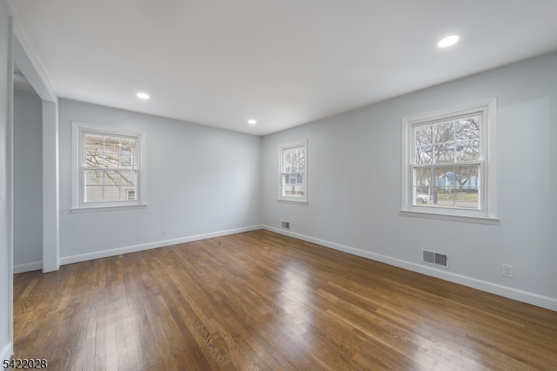 6 Windsor Way Berkeley Heights, NJ 07922 - Photo 27 of 36 a view of an empty room with wooden floor and a window