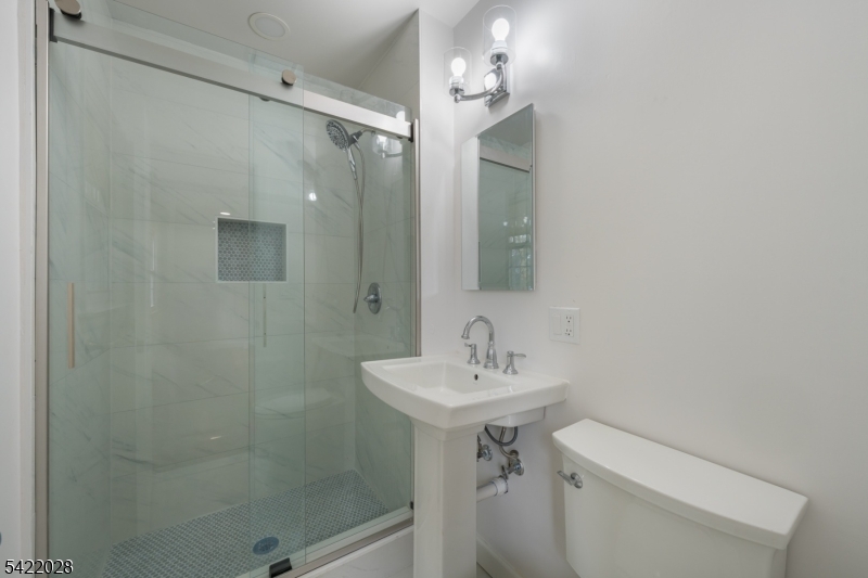 6 Windsor Way Berkeley Heights, NJ 07922 - Photo 28 of 36 a bathroom with a sink toilet and shower