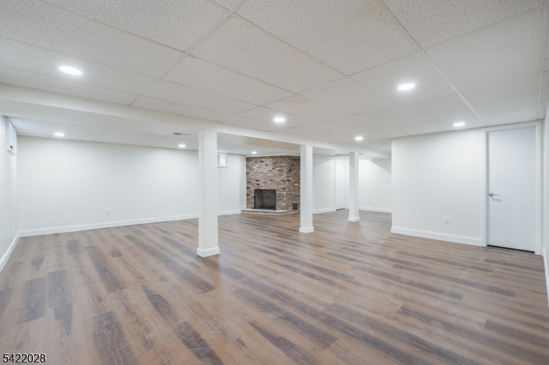 6 Windsor Way Berkeley Heights, NJ 07922 - Photo 30 of 36 an empty room with wooden floor and windows