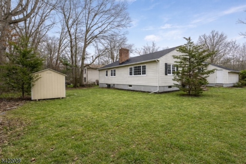 6 Windsor Way Berkeley Heights, NJ 07922 - Photo 3 of 36 a white house that has a tree in front of it