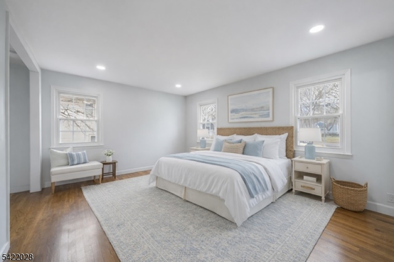 6 Windsor Way Berkeley Heights, NJ 07922 - Photo 6 of 36 a spacious bedroom with a bed and a couch
