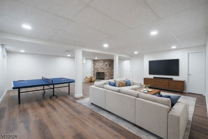 6 Windsor Way Berkeley Heights, NJ 07922 - Photo 7 of 36 a living room with furniture and a flat screen tv