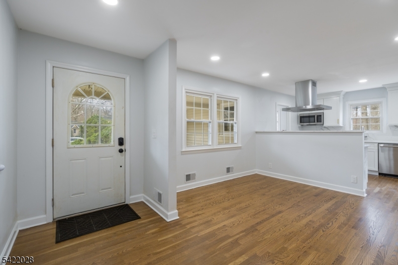 6 Windsor Way Berkeley Heights, NJ 07922 - Photo 8 of 36 a view of a kitchen with wooden floor and windows