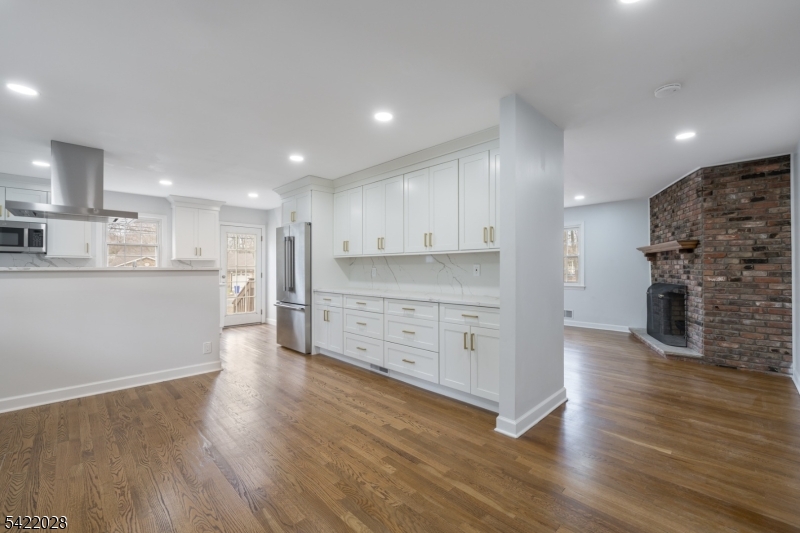 6 Windsor Way Berkeley Heights, NJ 07922 - Photo 9 of 36 a large kitchen with stainless steel appliances granite countertop a large counter top a sink and a stove