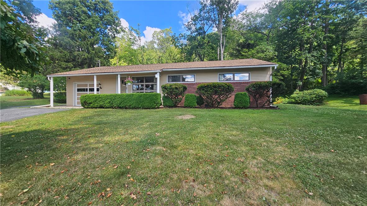 2529 Ringhoffer Road Hellertown, PA 18055 - Photo 3 of 33 A classic ranch home nestled among abundant greenery with a convenient attached garage.