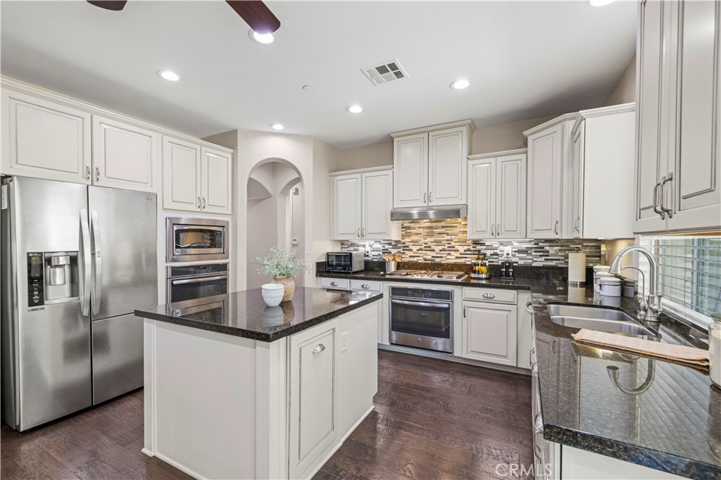 28319 Chisel Court Valencia, CA 91354 - Photo 11 of 74 a kitchen with stainless steel appliances granite countertop a refrigerator sink and cabinets