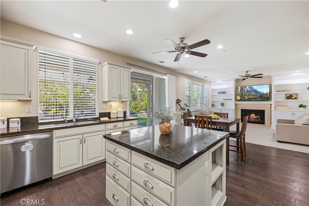 28319 Chisel Court Valencia, CA 91354 - Photo 13 of 74 a kitchen with granite countertop a stove a sink a dining table and chairs