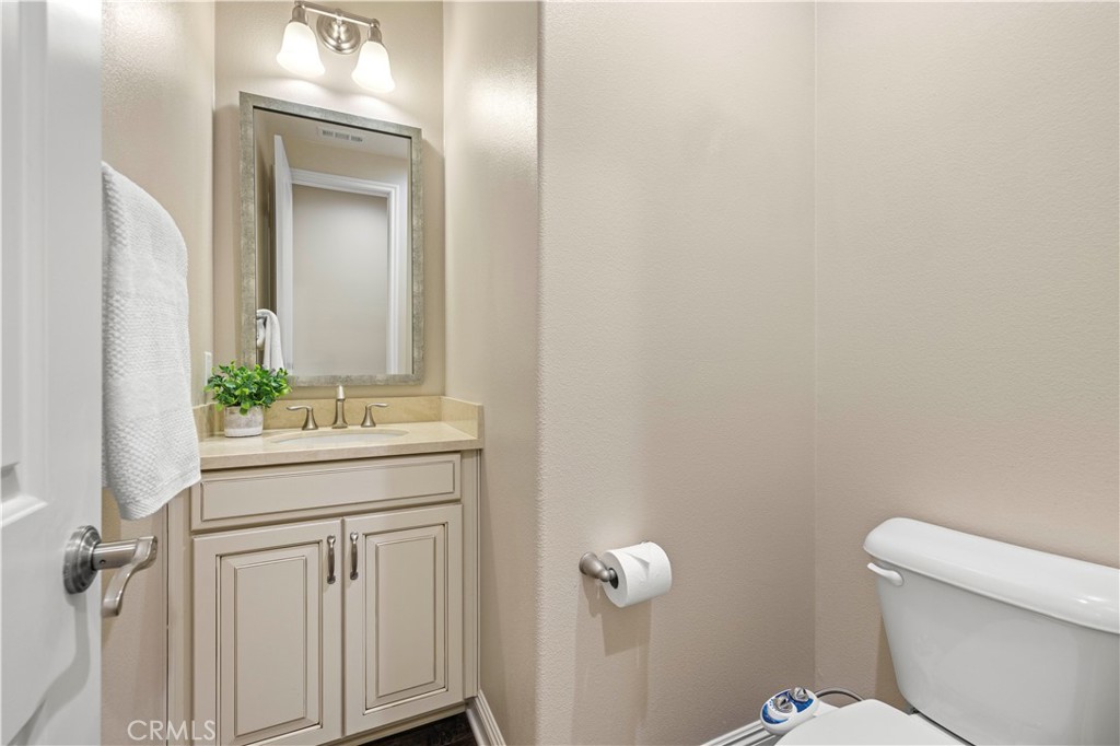 28319 Chisel Court Valencia, CA 91354 - Photo 18 of 74 a bathroom with a granite countertop sink and a mirror