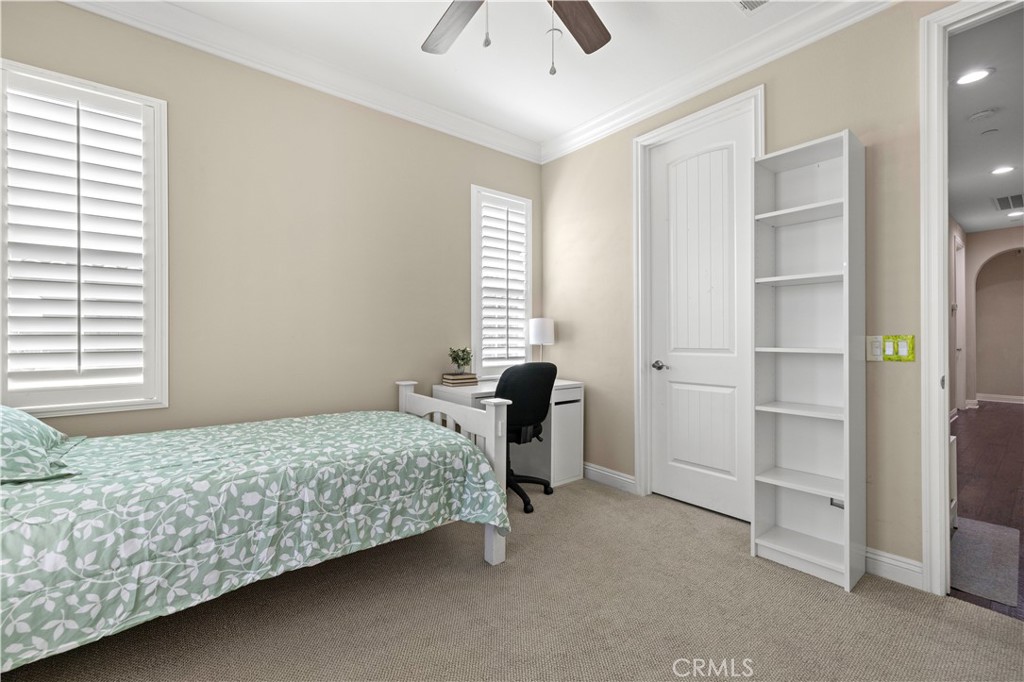 28319 Chisel Court Valencia, CA 91354 - Photo 27 of 74 a bedroom with a bed and a chandelier