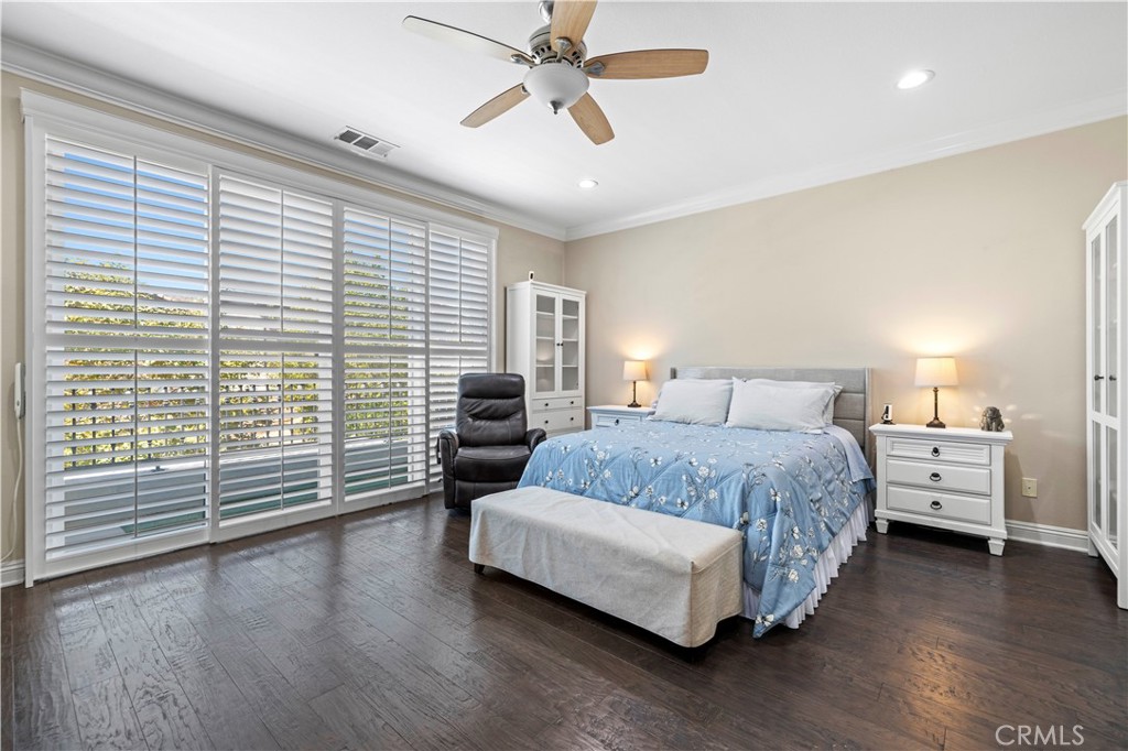 28319 Chisel Court Valencia, CA 91354 - Photo 35 of 74 a spacious bedroom with a bed and wooden floor