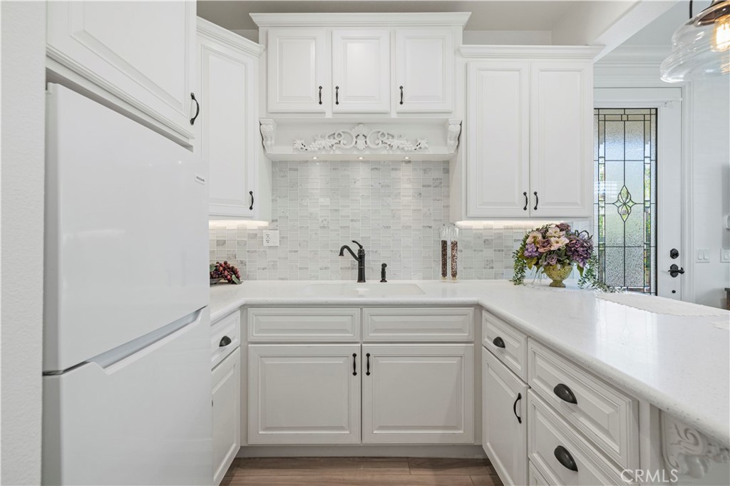 28319 Chisel Court Valencia, CA 91354 - Photo 44 of 74 a view of cabinets with wooden floor