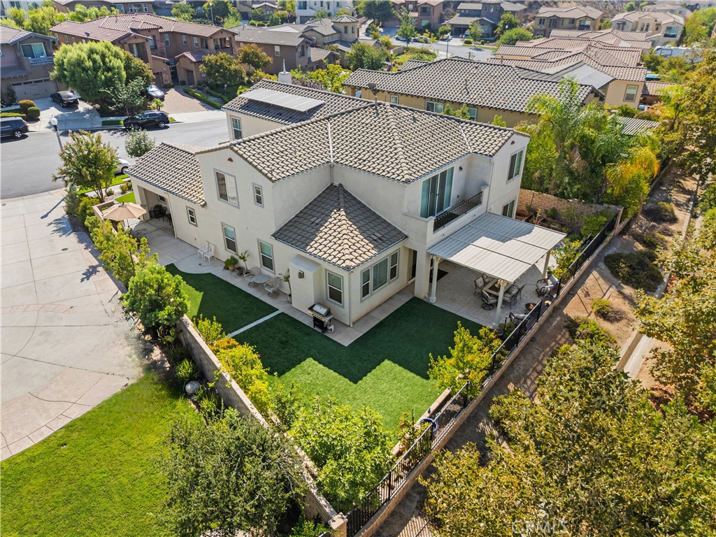 28319 Chisel Court Valencia, CA 91354 - Photo 63 of 74 an aerial view of a house with a big yard and potted plants