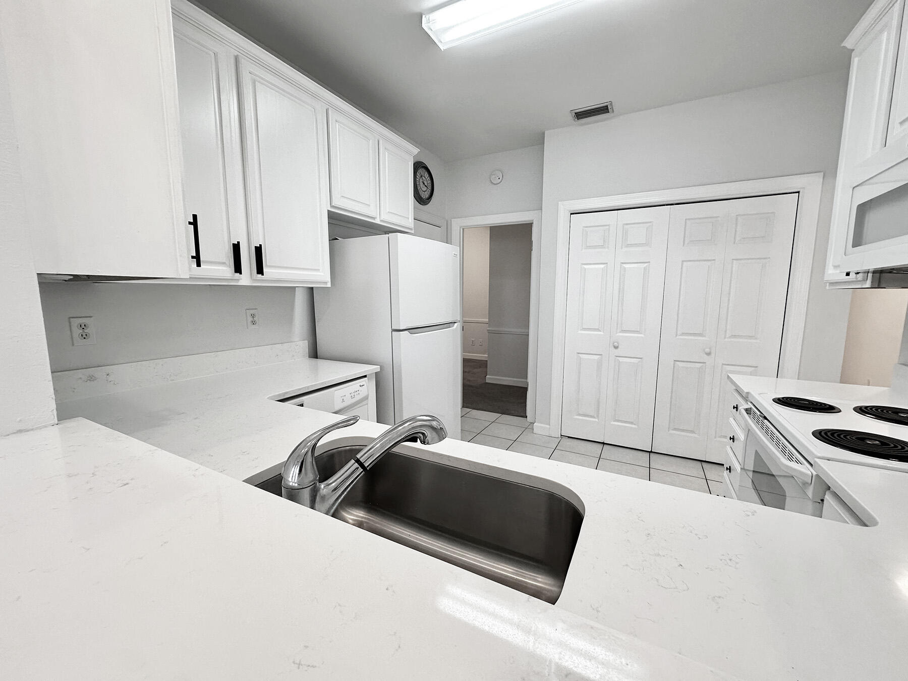 108 Mantero Way Destin, FL 32541 - Photo 13 of 36 a kitchen with a refrigerator a stove top oven a sink and cabinets