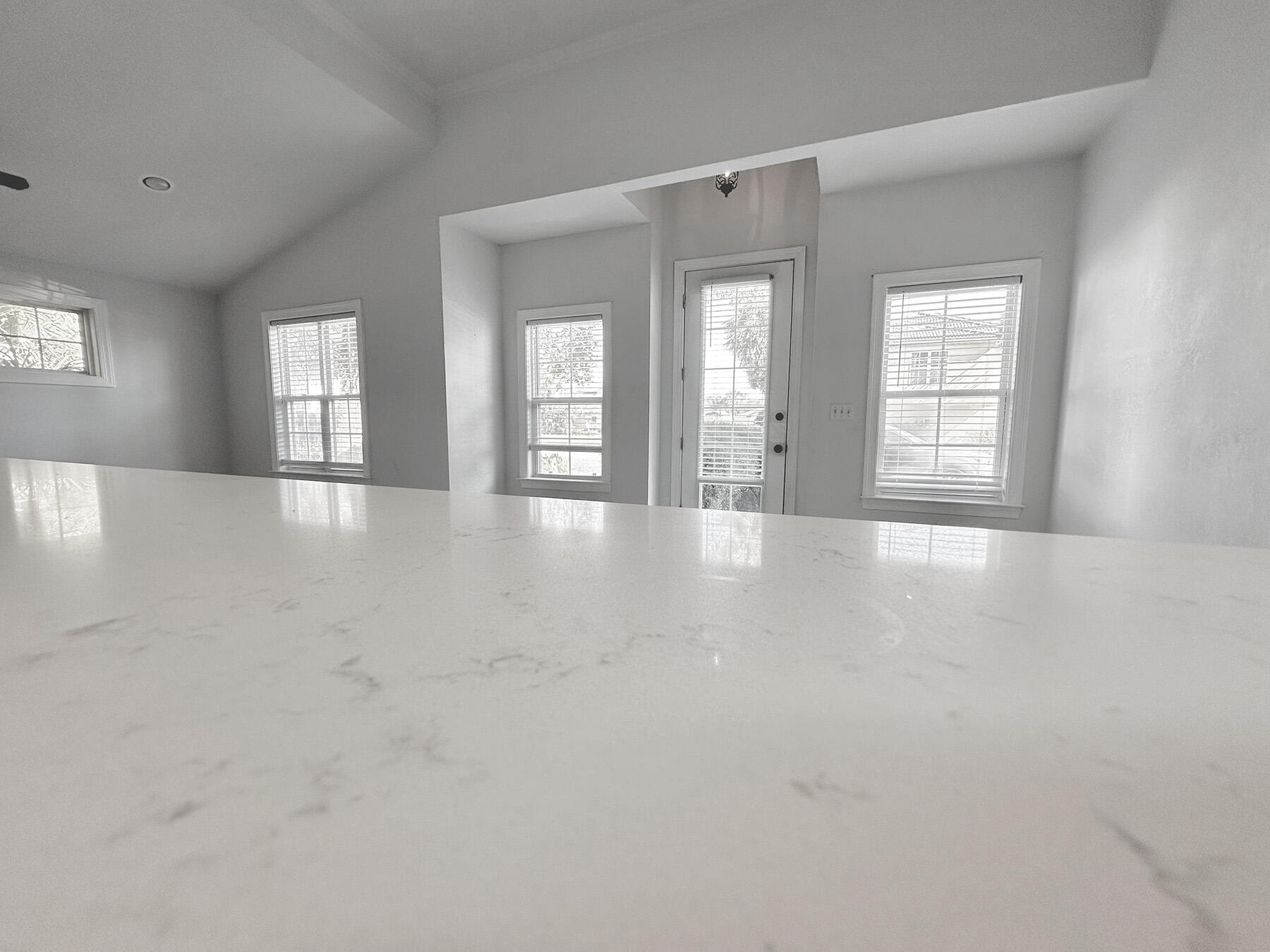 108 Mantero Way Destin, FL 32541 - Photo 14 of 36 a view of an empty room with window and wooden floor