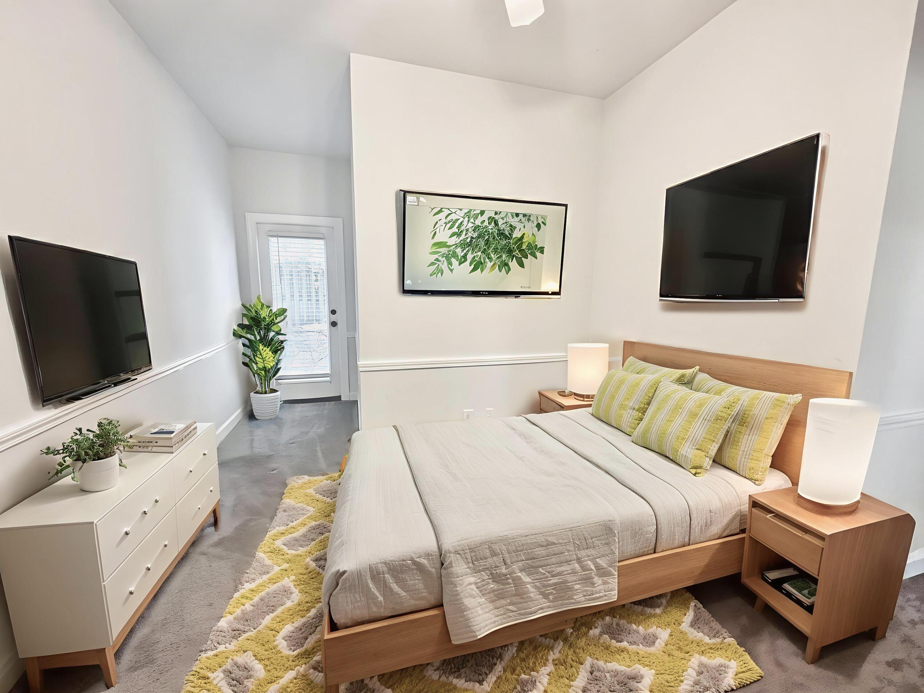 108 Mantero Way Destin, FL 32541 - Photo 19 of 36 a bedroom with a bed and a flat screen tv