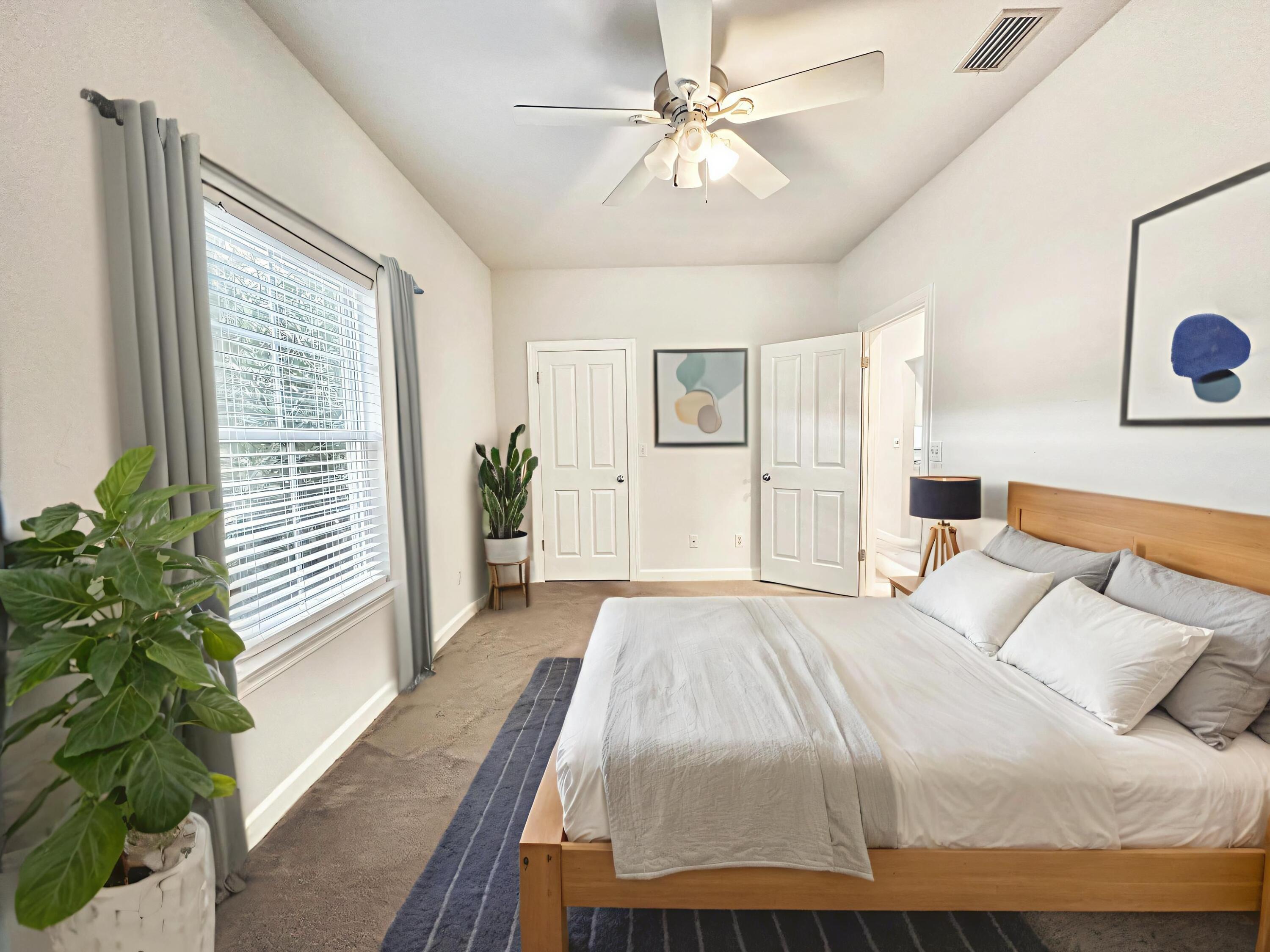 108 Mantero Way Destin, FL 32541 - Photo 25 of 36 a bedroom with a large bed and a chandelier