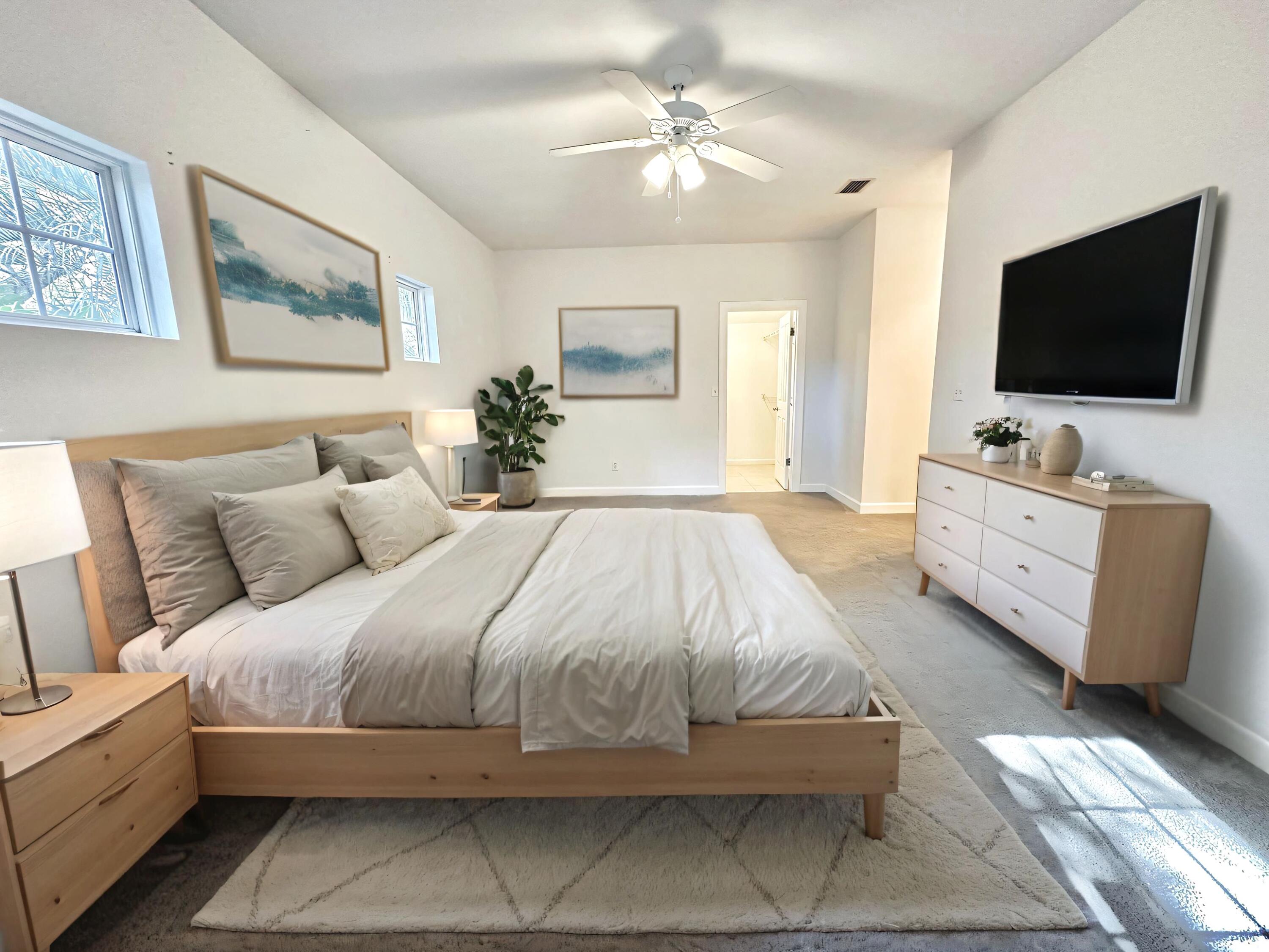 108 Mantero Way Destin, FL 32541 - Photo 27 of 36 a spacious bedroom with a bed and a flat screen tv