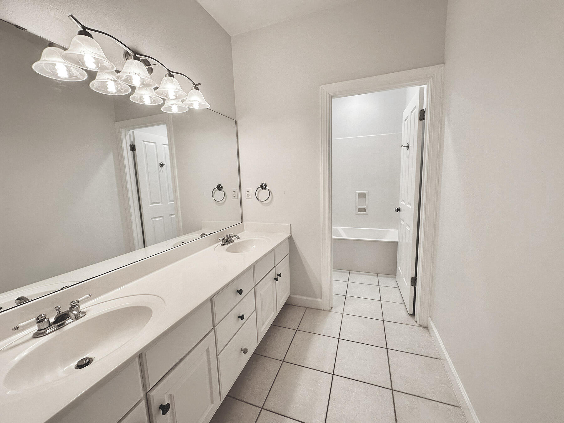 108 Mantero Way Destin, FL 32541 - Photo 29 of 36 a spacious bathroom with a double vanity sink mirror and a toilet