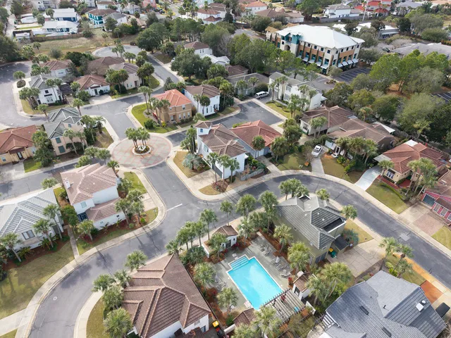 an aerial view of residential houses with outdoor space