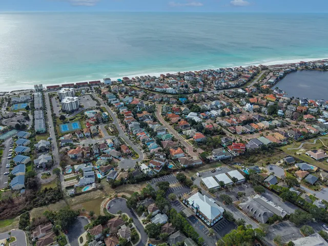 an aerial view of a house with a ocean view