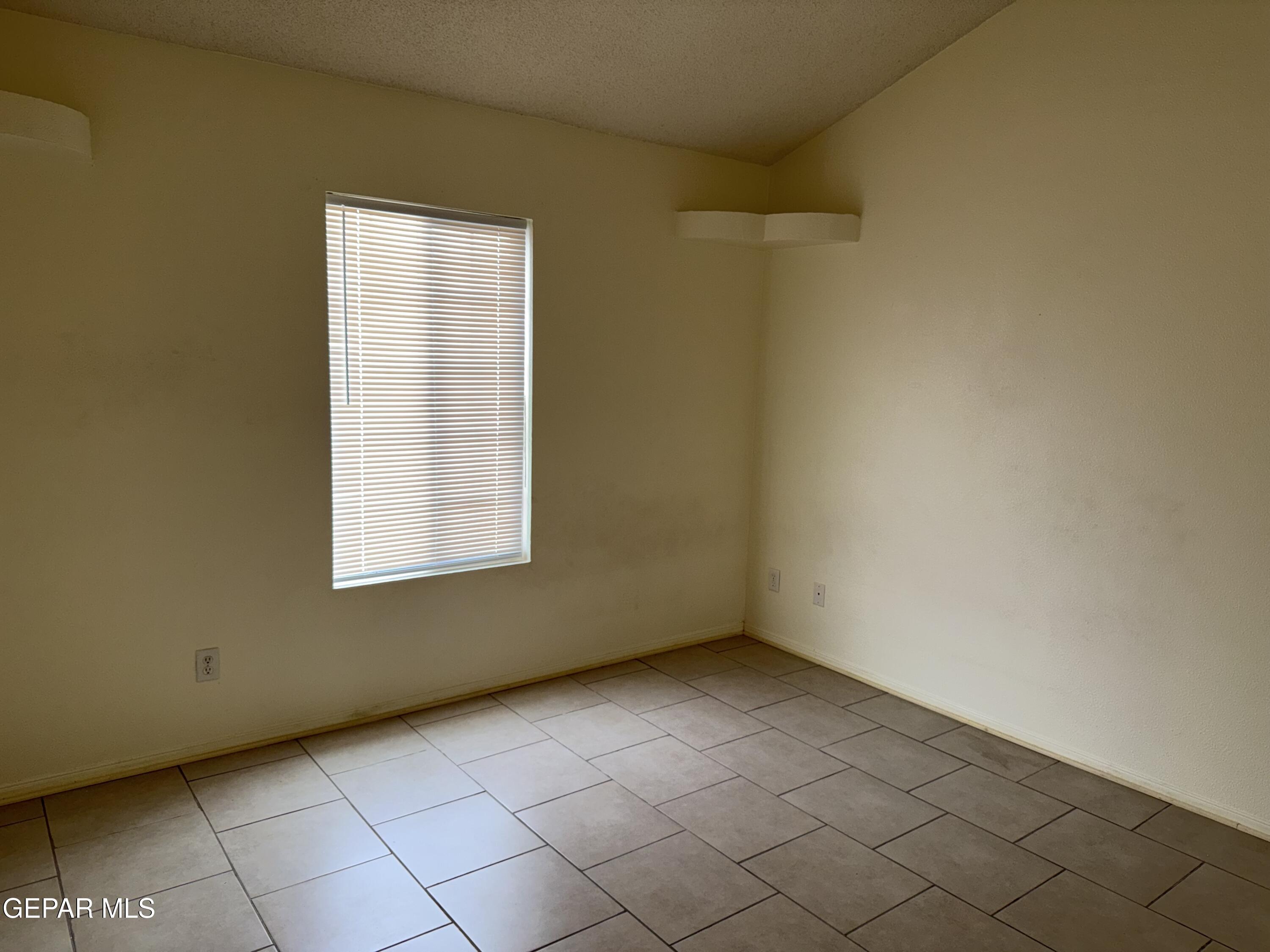 456 Passmore Road Socorro, TX 79927 - Photo 13 of 23 a view of an empty room with a window