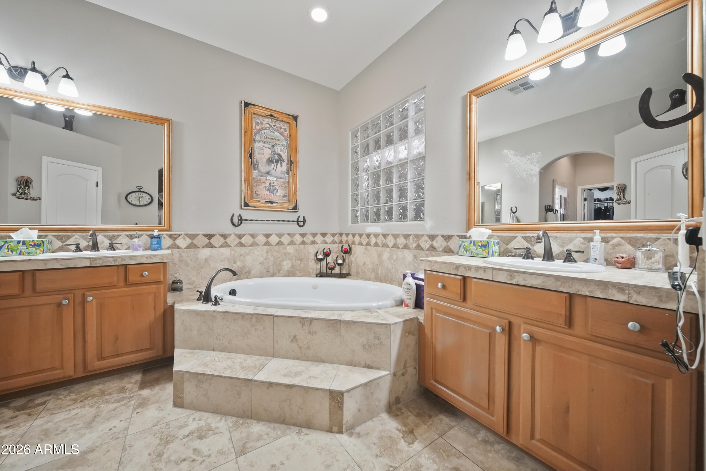 605 West Ridgecrest Road Phoenix, AZ 85086 - Photo 27 of 40 a spacious bathroom with a double vanity sink mirror and bathtub