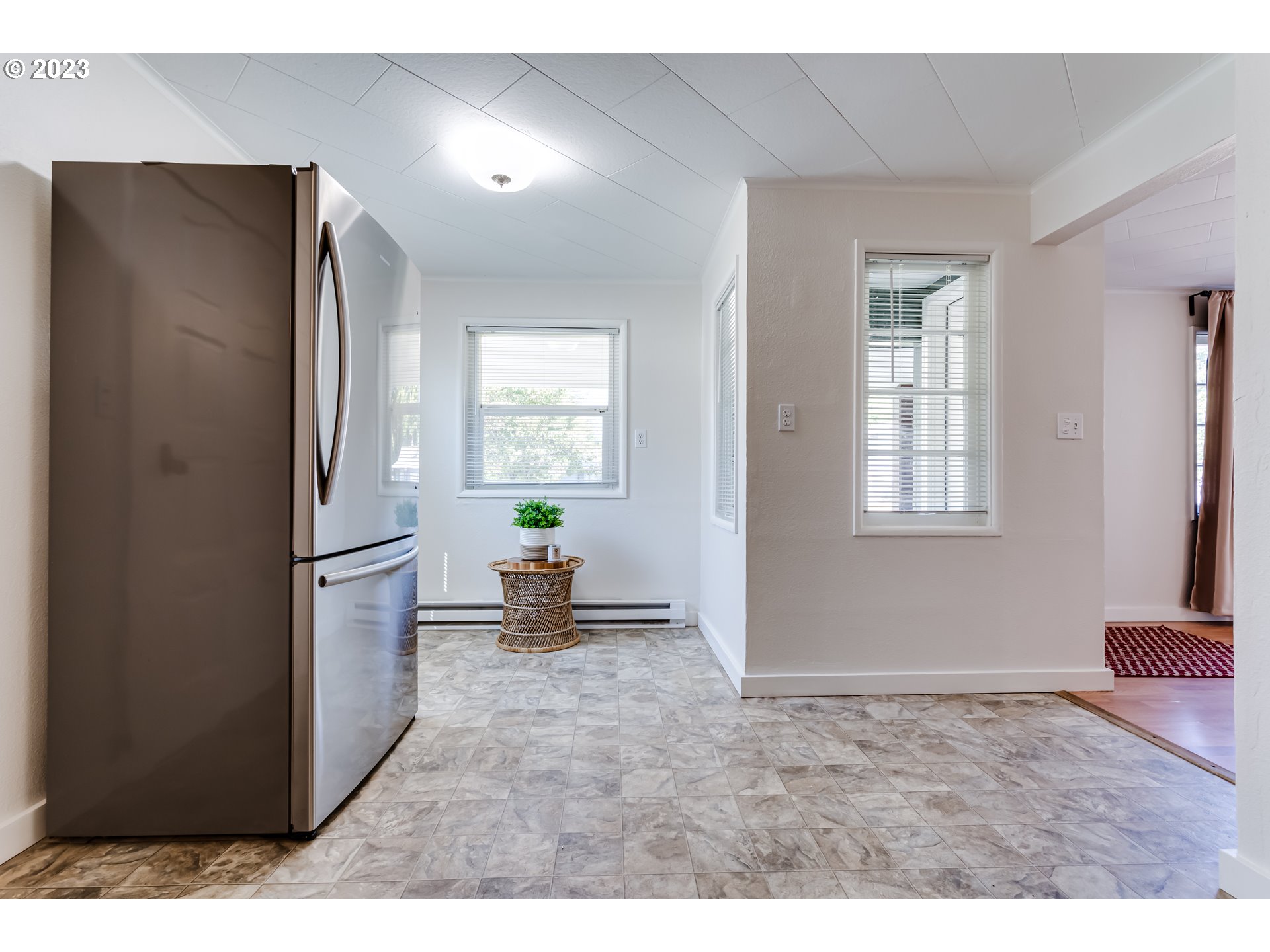 375 South 51st Place Springfield, OR 97478 - Photo 12 of 31 a kitchen with stainless steel appliances refrigerator and window