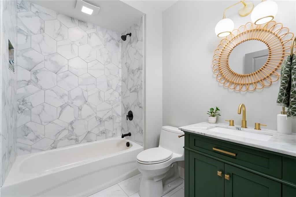 712 Cedar Avenue Pittsburgh, PA 15212 - Photo 13 of 25 a bathroom with a sink a toilet and a bathtub