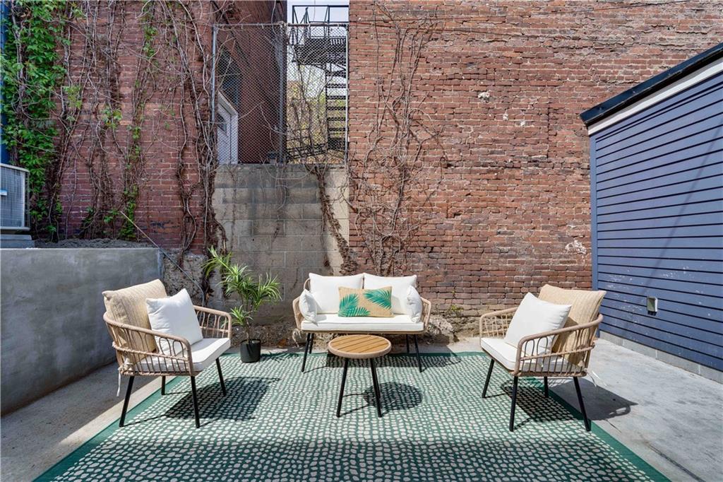 712 Cedar Avenue Pittsburgh, PA 15212 - Photo 17 of 25 a view of a patio with couple of chairs