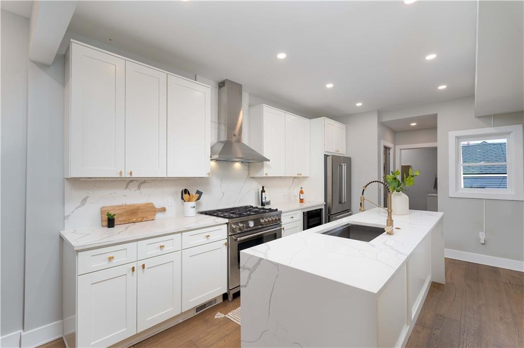 712 Cedar Avenue Pittsburgh, PA 15212 - Photo 2 of 25 a kitchen with a sink a stove and cabinets