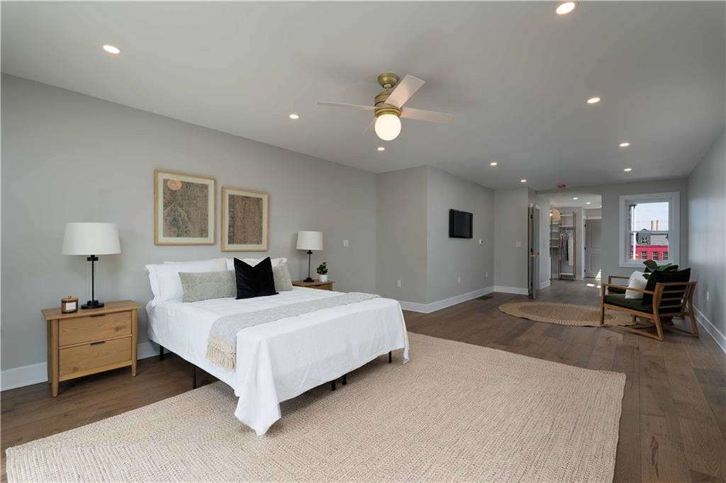 712 Cedar Avenue Pittsburgh, PA 15212 - Photo 7 of 25 a bedroom with a bed and a chair