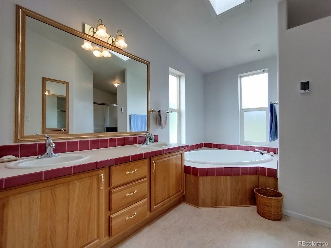 10421 West Lane Rye, CO 81069 - Photo 12 of 34 a bathroom with a sink and a mirror