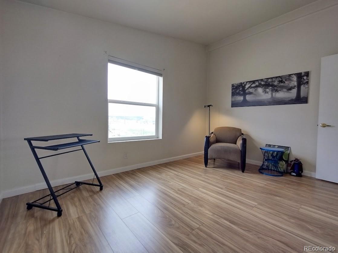 10421 West Lane Rye, CO 81069 - Photo 15 of 34 a room with furniture and a window