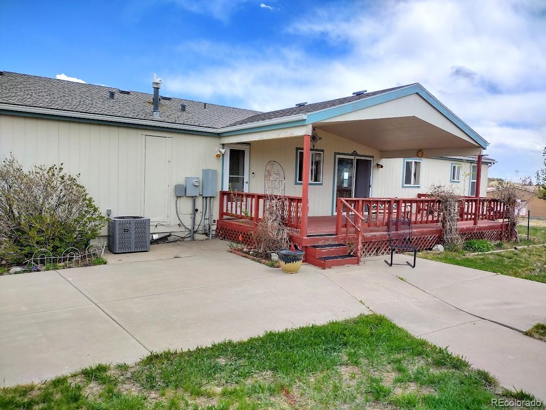 10421 West Lane Rye, CO 81069 - Photo 20 of 34 a view of patio with a table and chairs under an umbrella
