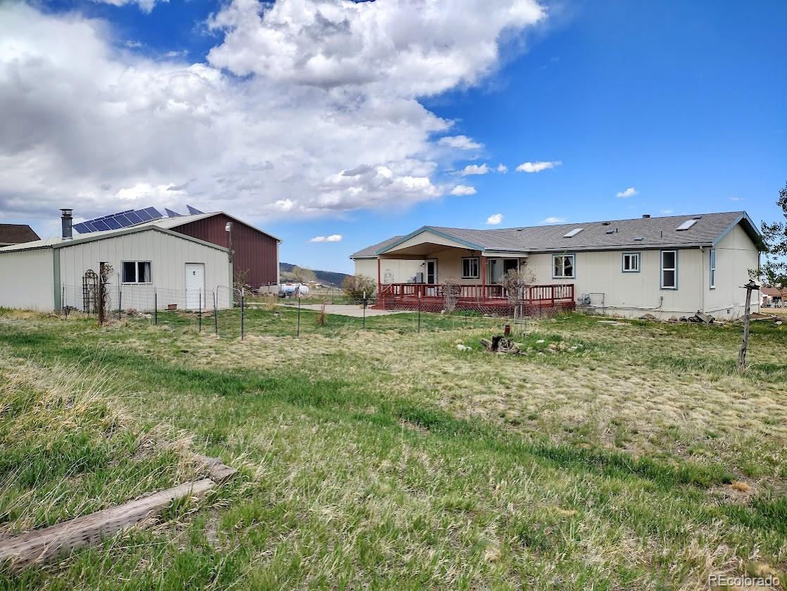 10421 West Lane Rye, CO 81069 - Photo 21 of 34 a view of a house with yard and sitting area