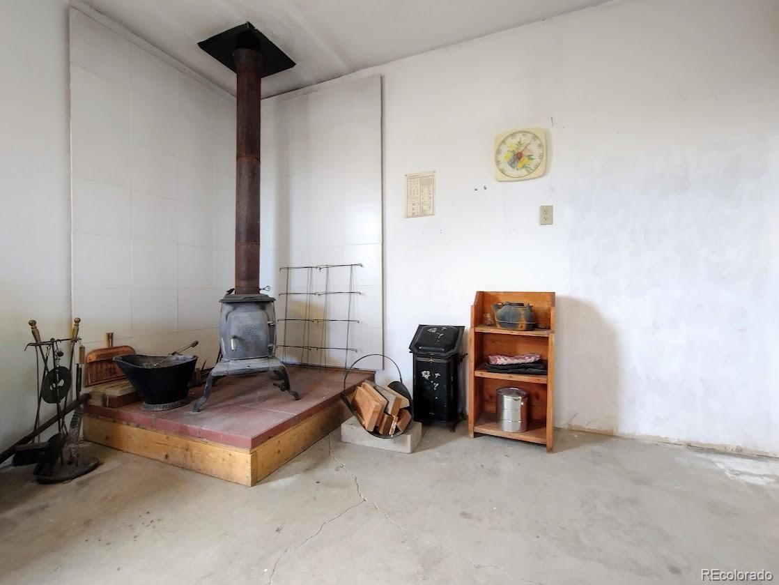 10421 West Lane Rye, CO 81069 - Photo 27 of 34 a living room with furniture and a lamp