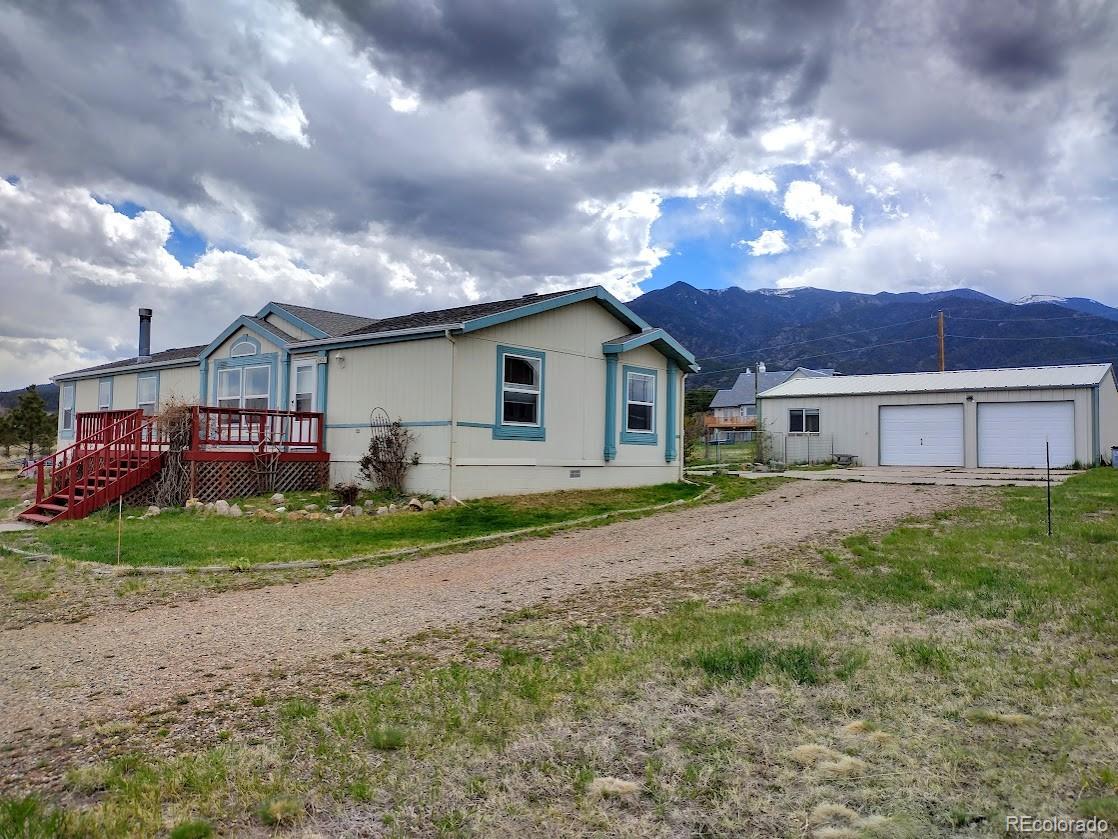 10421 West Lane Rye, CO 81069 - Photo 29 of 34 a view of a house with a back yard