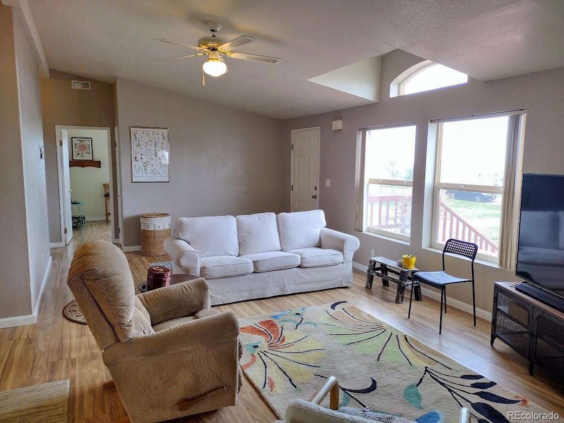 10421 West Lane Rye, CO 81069 - Photo 3 of 34 a living room with furniture a flat screen tv and a large window