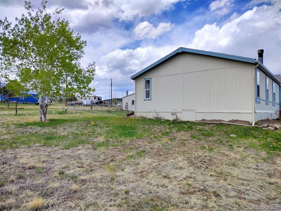 10421 West Lane Rye, CO 81069 - Photo 33 of 34 a house with garden in front of it