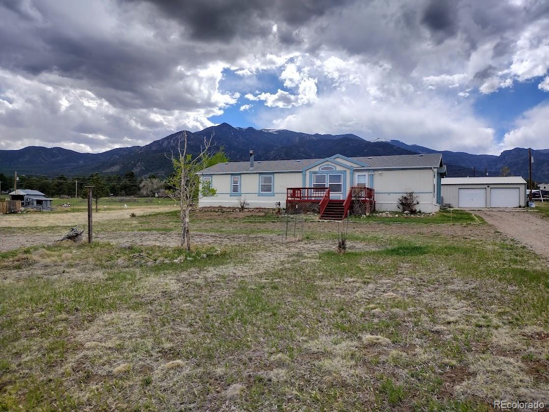 10421 West Lane Rye, CO 81069 - Photo 34 of 34 a view of a house with a yard