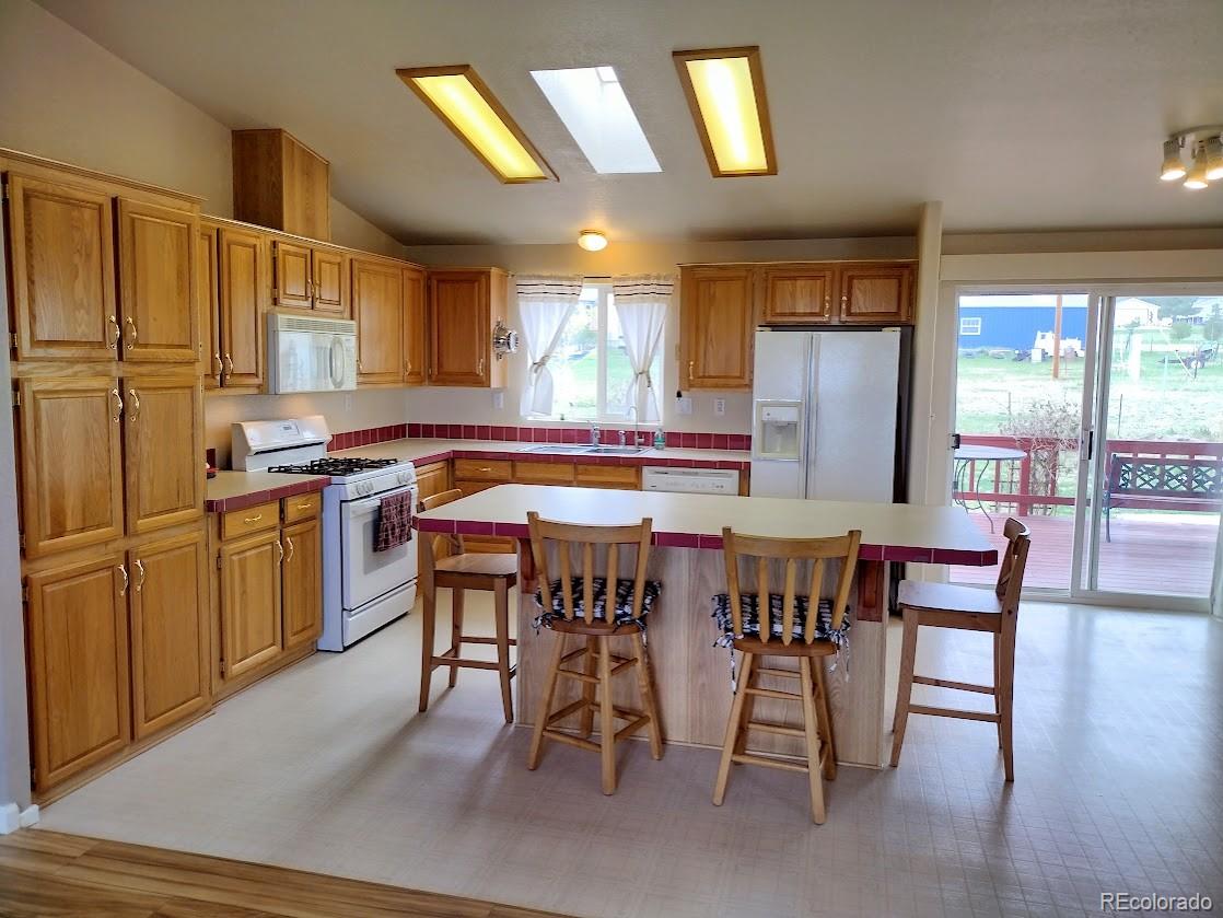 10421 West Lane Rye, CO 81069 - Photo 8 of 34 a view of a dining room with furniture window and wooden floor