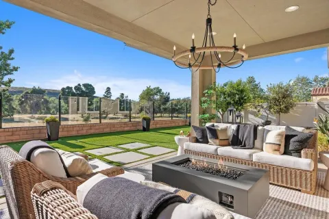 a view of a patio with couches chairs and a table