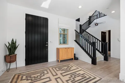 a view of entryway and hall with a potted plant