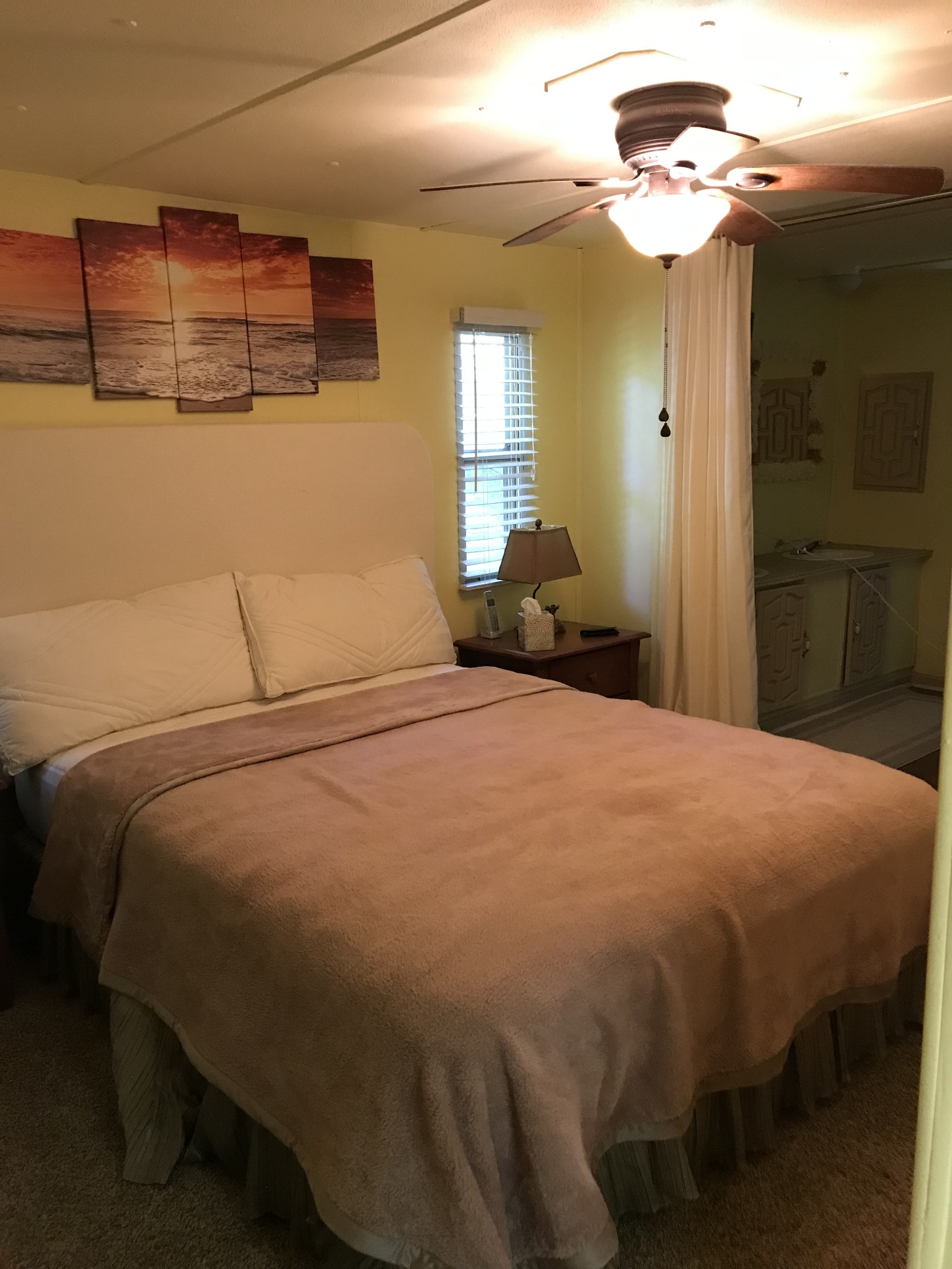 9026 Greenbriar Road Waverly, TN 37185 - Photo 10 of 19 a bedroom with a bed and a chandelier